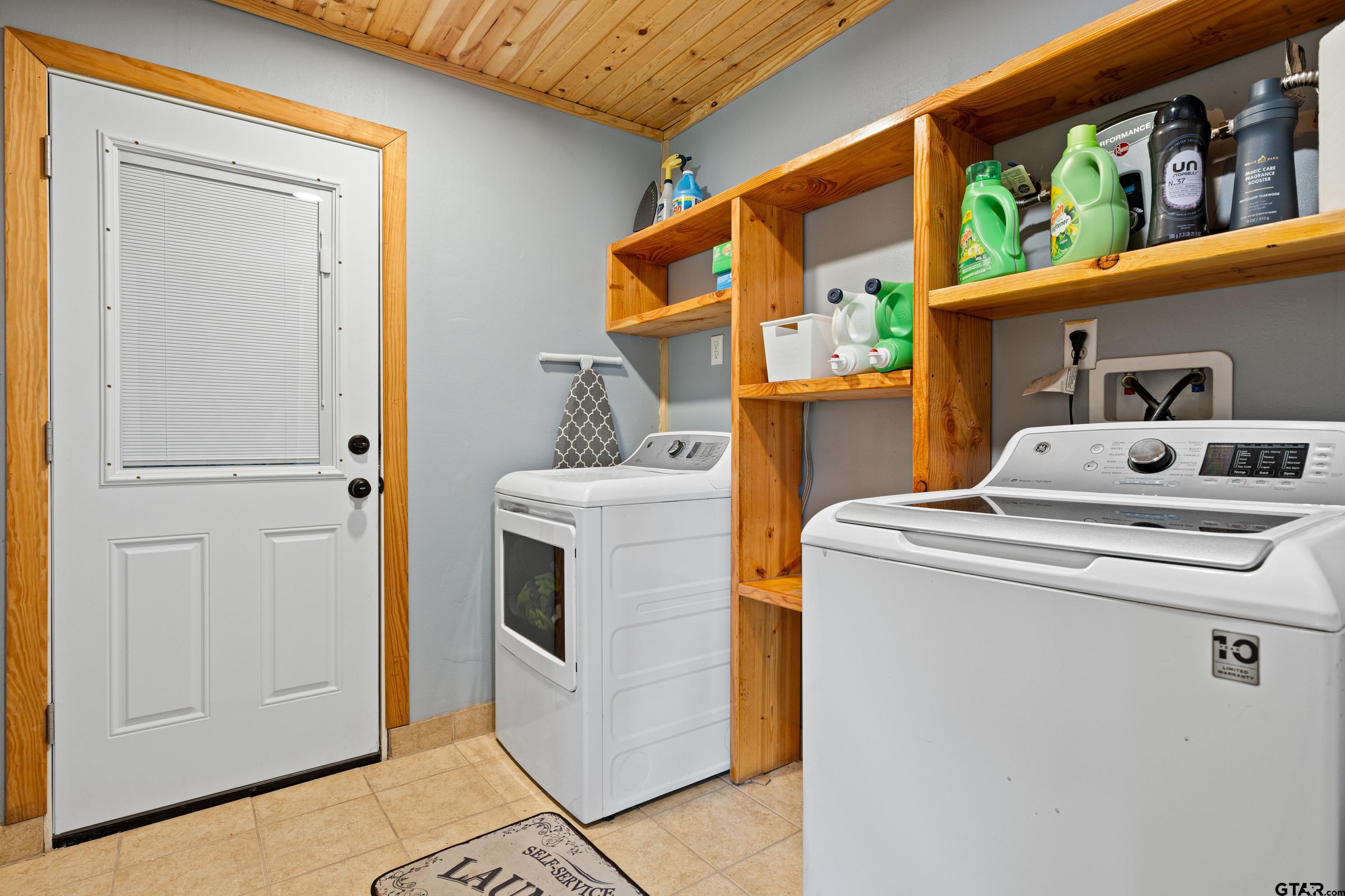 423 County Road 4306 Naples, TX 75568 - Photo 41 of 47 a utility room with dryer and washer