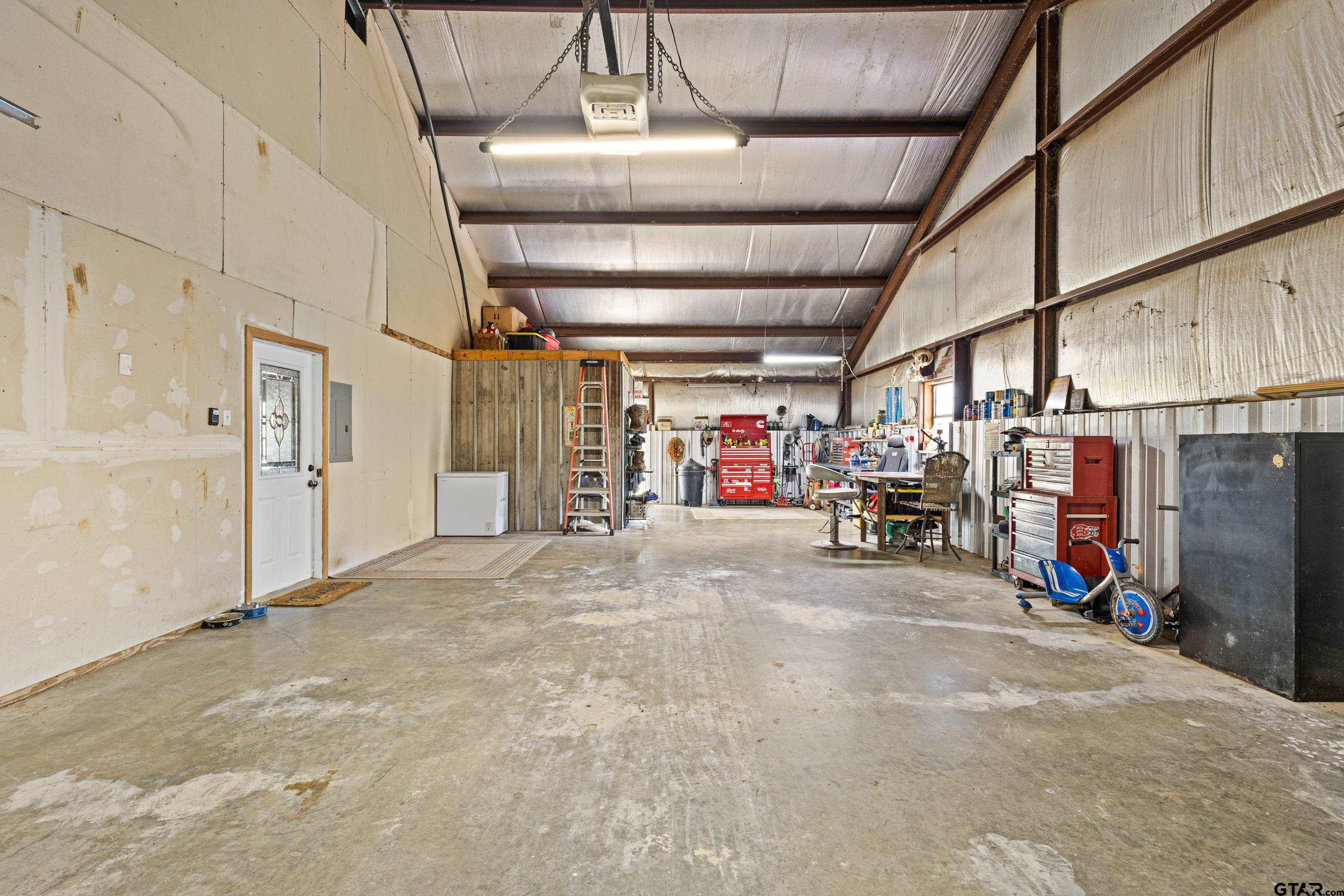 423 County Road 4306 Naples, TX 75568 - Photo 43 of 47 a view of a storage room with lot of stuff