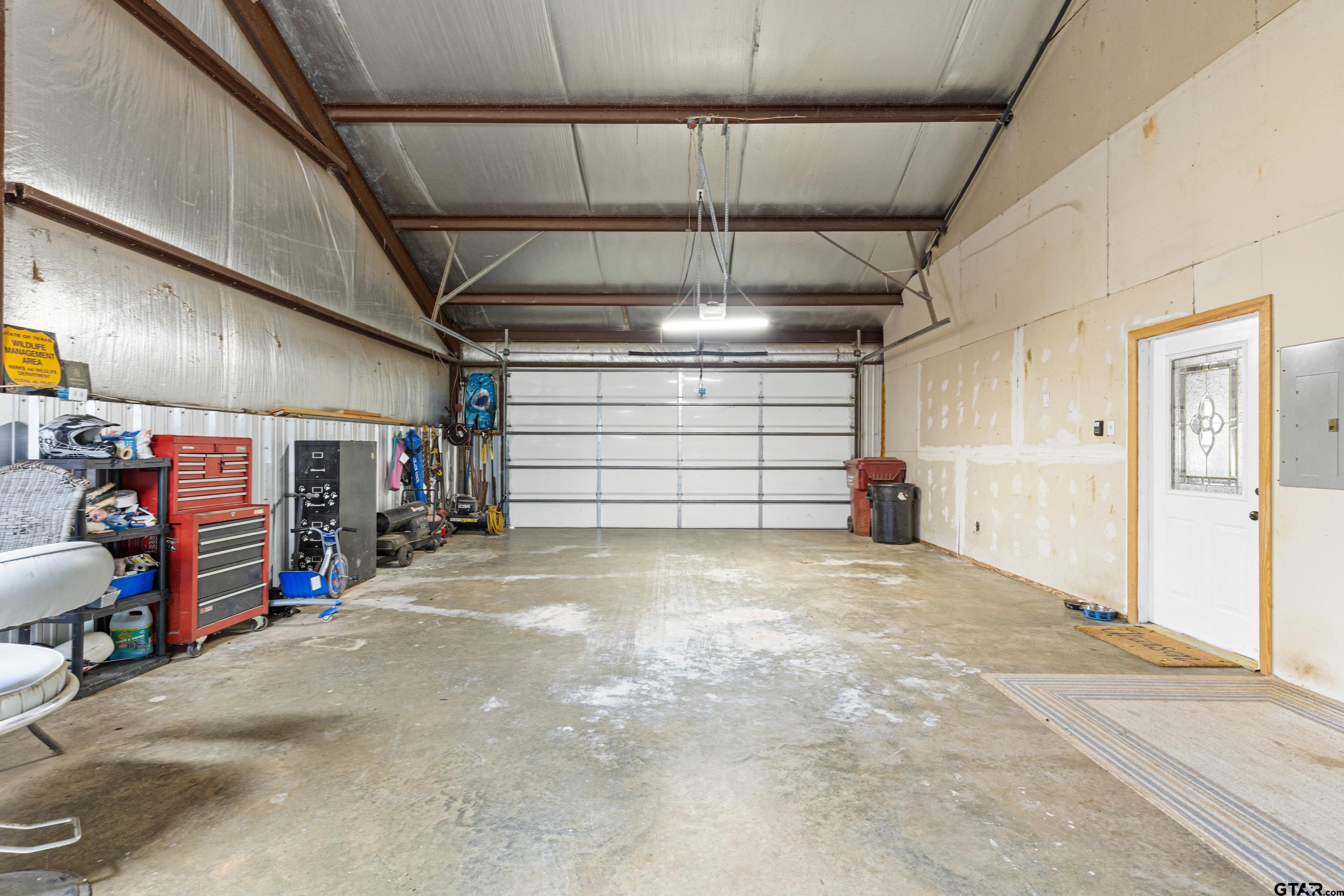 423 County Road 4306 Naples, TX 75568 - Photo 44 of 47 a view of empty room with a ceiling fan