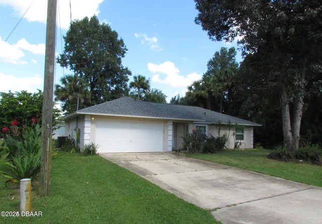 a house view with a garden space