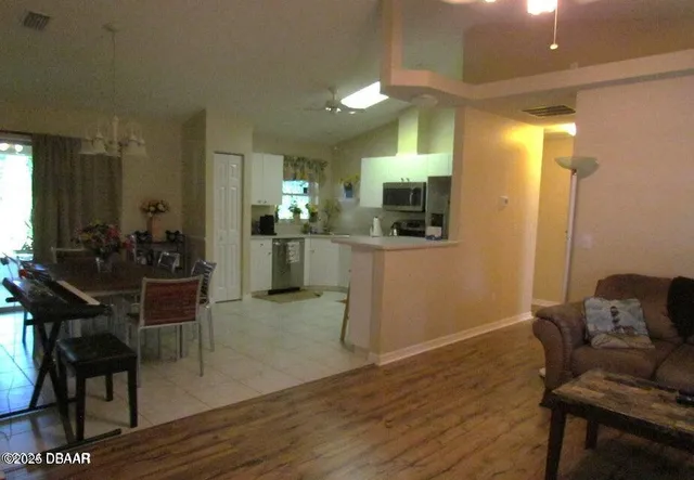 a kitchen with a table and chairs in it