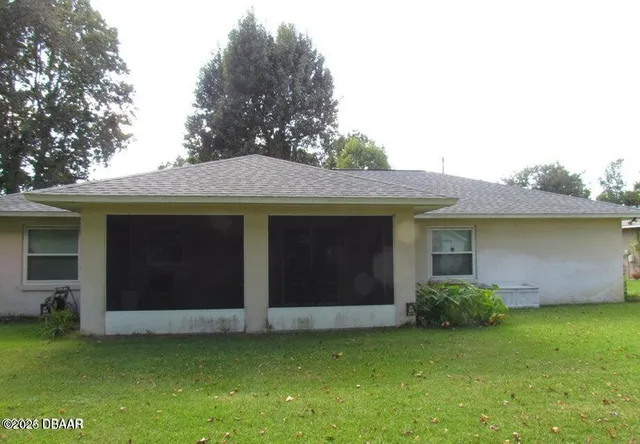 a view of a house with a garden