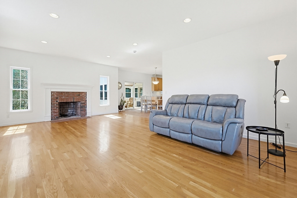 11 Broken Tree Road Medway, MA 02053 - Photo 11 of 42 a living room with furniture and a fireplace