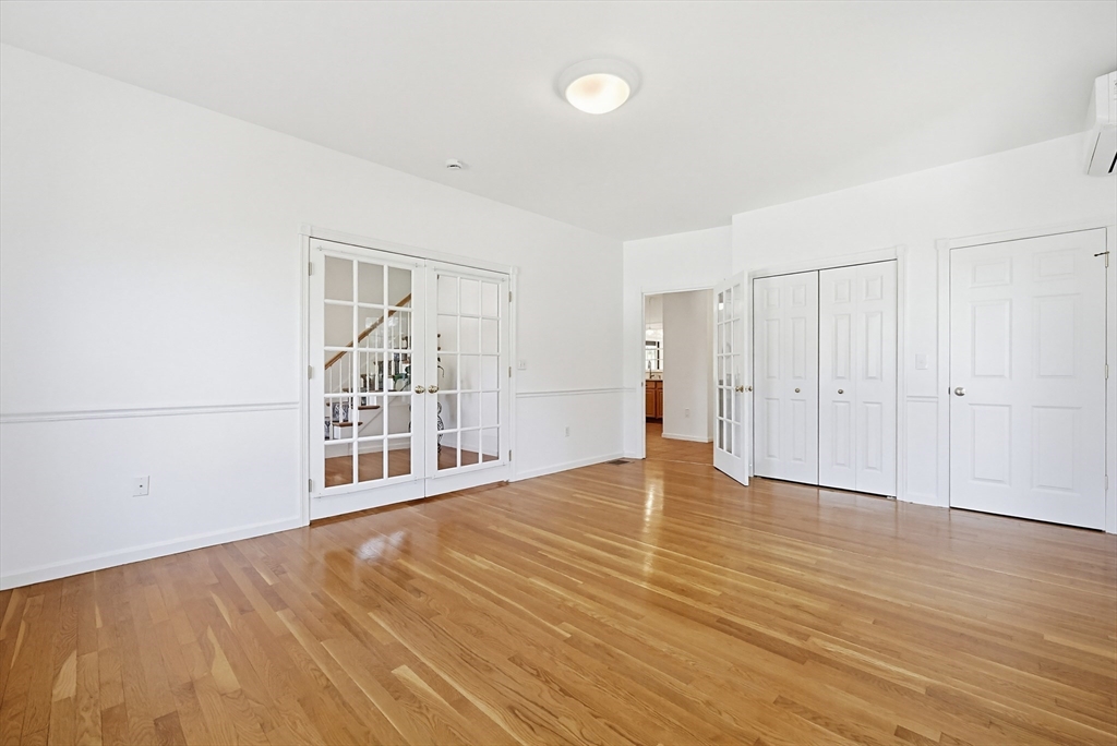 11 Broken Tree Road Medway, MA 02053 - Photo 14 of 42 a view of an empty room with wooden floor and a window