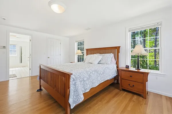 a bedroom with a bed and window