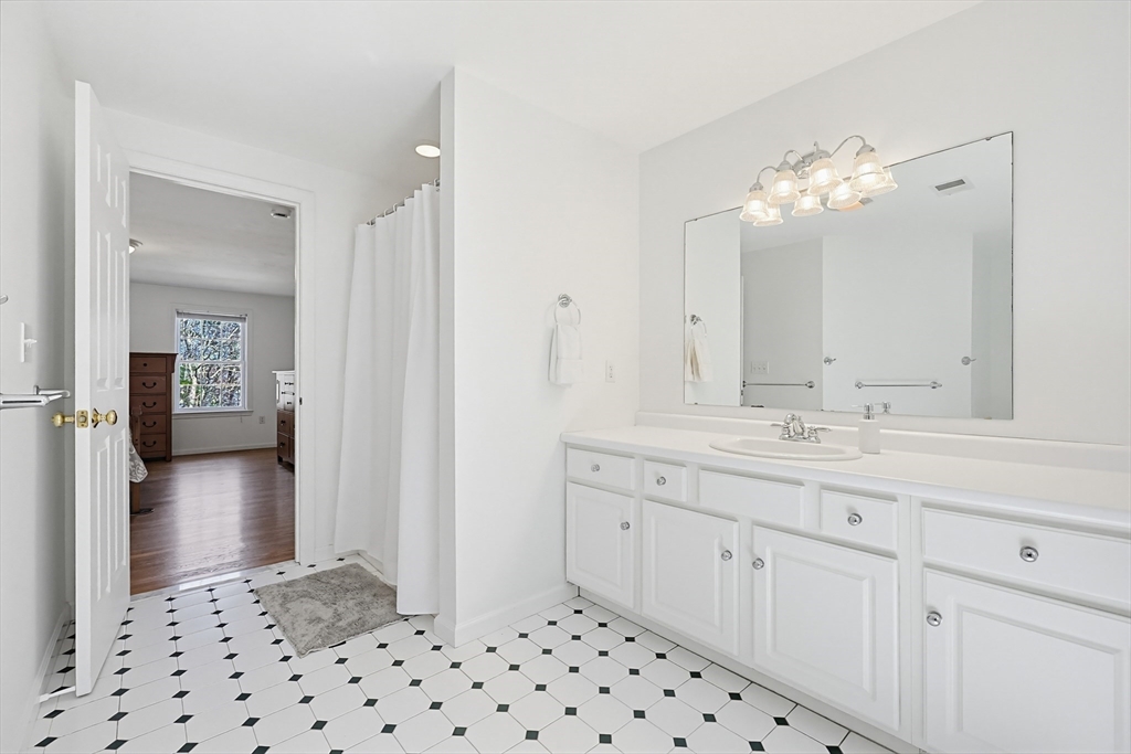 11 Broken Tree Road Medway, MA 02053 - Photo 21 of 42 a bathroom with a sink vanity and a mirror