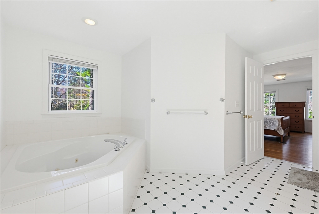 11 Broken Tree Road Medway, MA 02053 - Photo 23 of 42 a bathroom with a bathtub and a shower