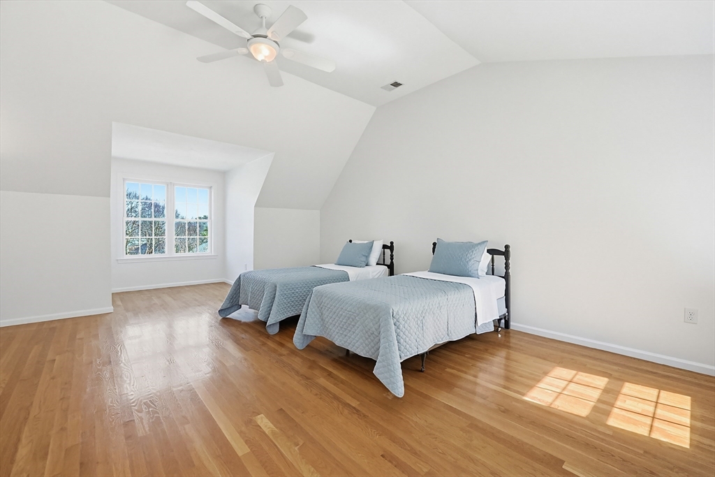 11 Broken Tree Road Medway, MA 02053 - Photo 24 of 42 a bedroom with a bed and wooden floor