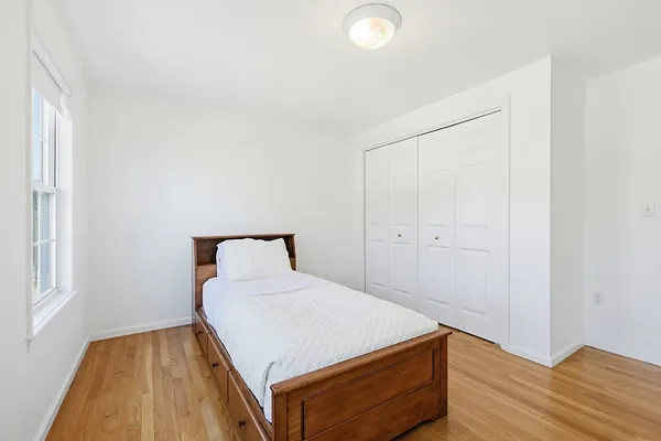 a room with a bed and a window