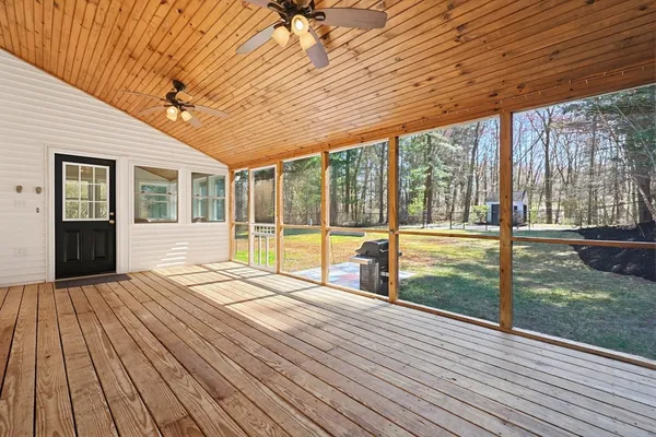 a balcony with wooden floor