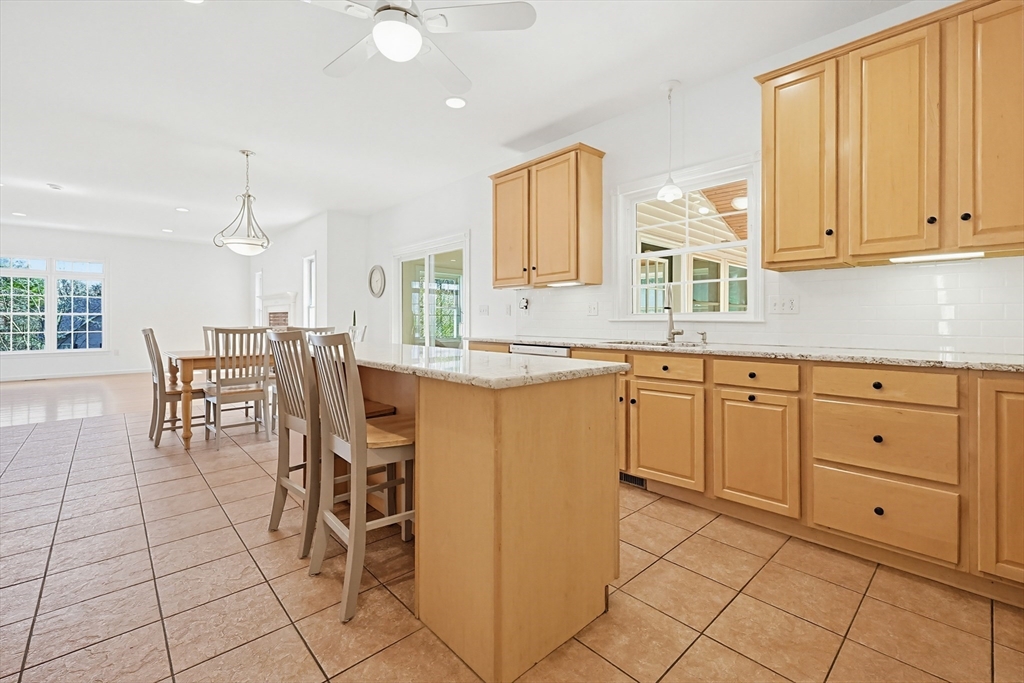 11 Broken Tree Road Medway, MA 02053 - Photo 7 of 42 a kitchen with cabinets and chairs