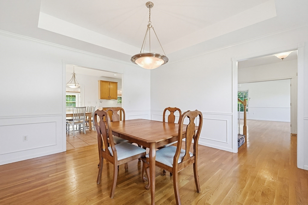 11 Broken Tree Road Medway, MA 02053 - Photo 9 of 42 a dining room with furniture and wooden floor