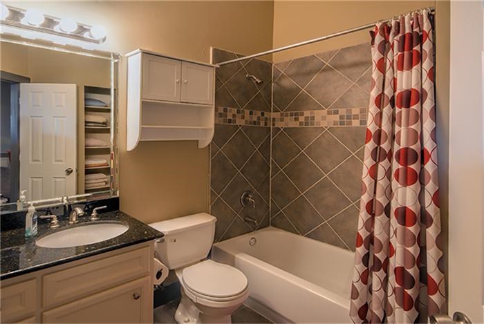 1414 Emancipation Avenue, Unit A Houston, TX 77003 - Photo 11 of 22 a bathroom with a sink toilet and shower