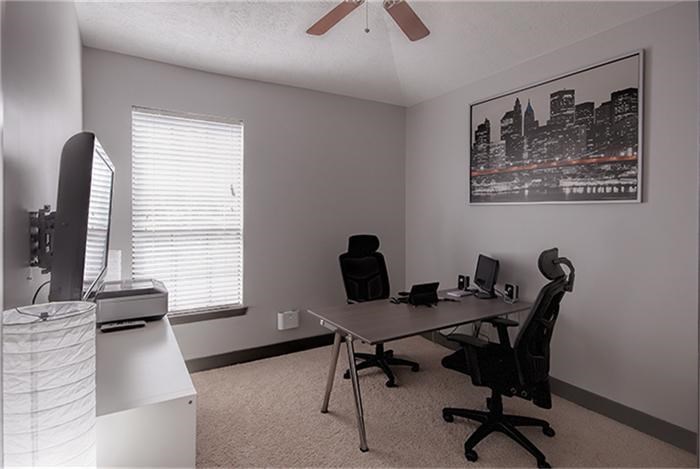 1414 Emancipation Avenue, Unit A Houston, TX 77003 - Photo 12 of 22 a workspace with furniture and a window