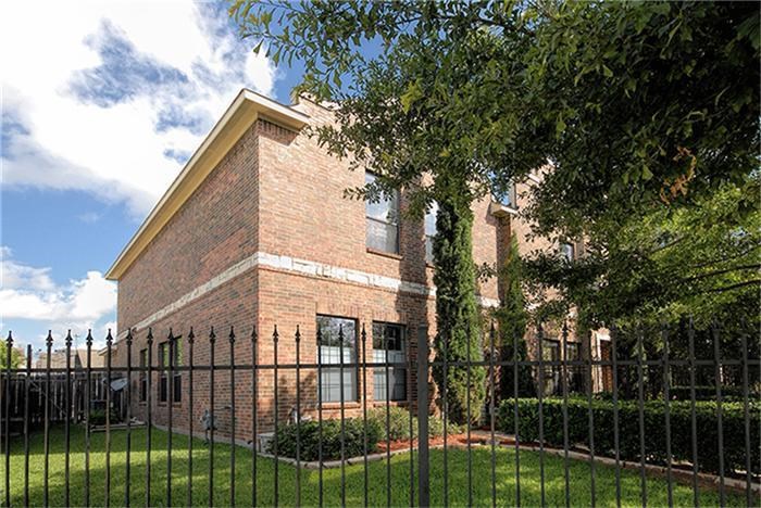 1414 Emancipation Avenue, Unit A Houston, TX 77003 - Photo 2 of 22 a view of a backyard with a large tree