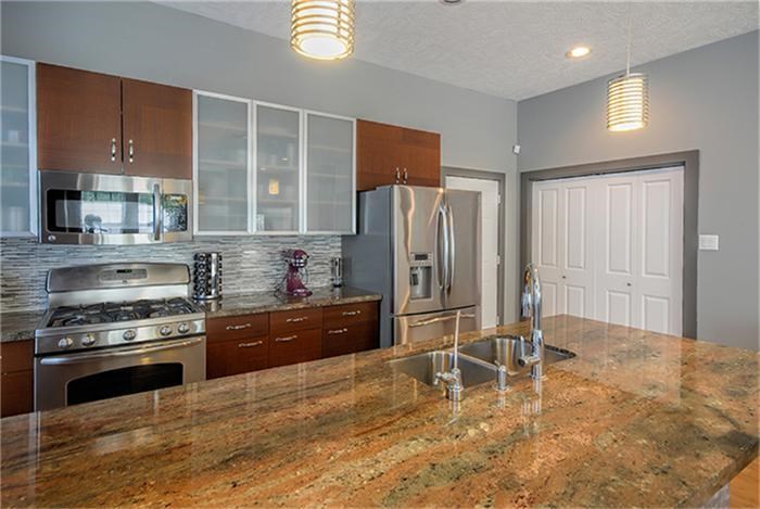 1414 Emancipation Avenue, Unit A Houston, TX 77003 - Photo 8 of 22 a kitchen with stainless steel appliances granite countertop a stove refrigerator and cabinets