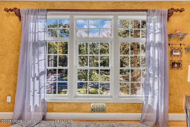 a view of a brick house with a large window