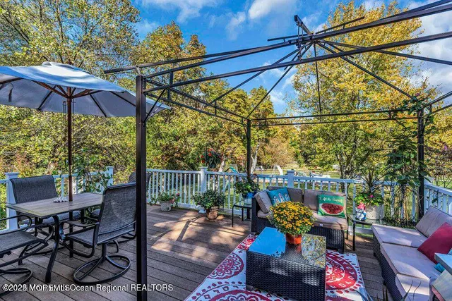 a view of a swimming pool with a yard and sitting area