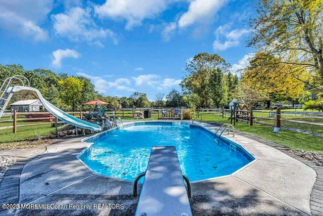 a view of a swimming pool with a sitting area