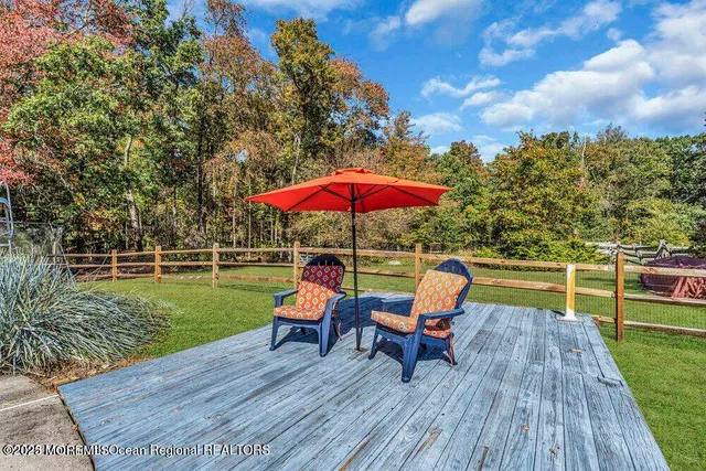 a view of a park with bench and trees