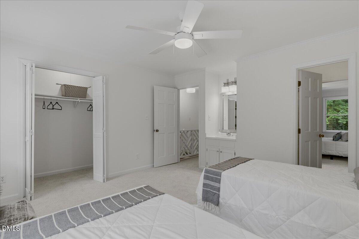 2834 Wayland Drive Raleigh, NC 27608 - Photo 18 of 26 a bedroom with a bed and a shower