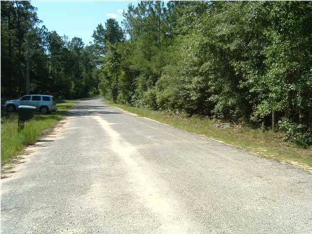 6151 Donald Guy Road Crestview, FL 32539 - Photo 24 of 24 a view of a patio with a yard