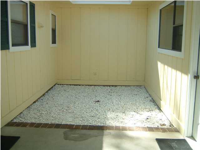 6151 Donald Guy Road Crestview, FL 32539 - Photo 4 of 24 a view of wooden floor and a chair