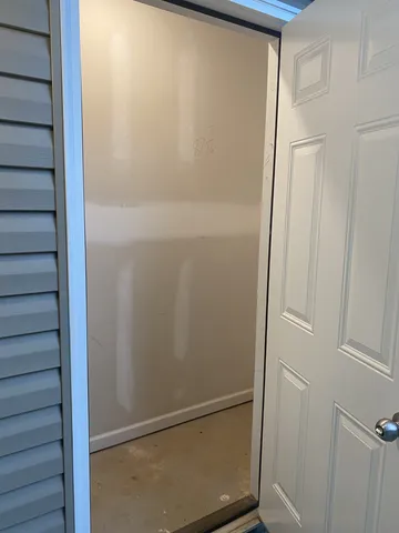 a bathroom with a glass shower door
