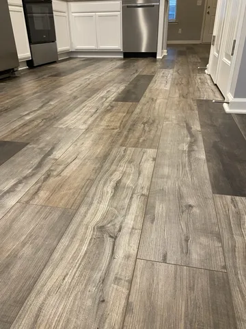 a view of a kitchen with wooden floor
