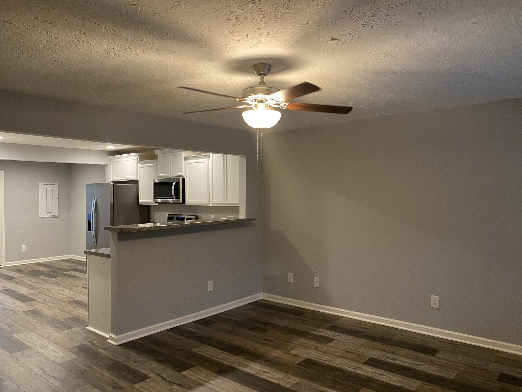 2378 Age Avenue Murfreesboro, TN 37130 - Photo 2 of 33 a kitchen with granite countertop cabinets stainless steel appliances and a chandelier