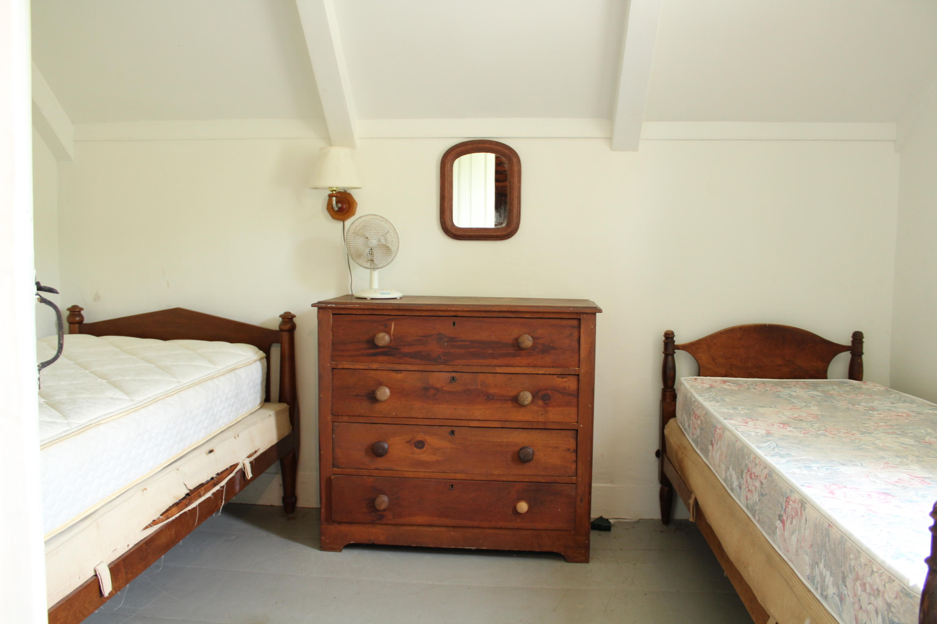 9 Castle Road Truro, MA 02666 - Photo 21 of 65 a bedroom with a bed and a dresser