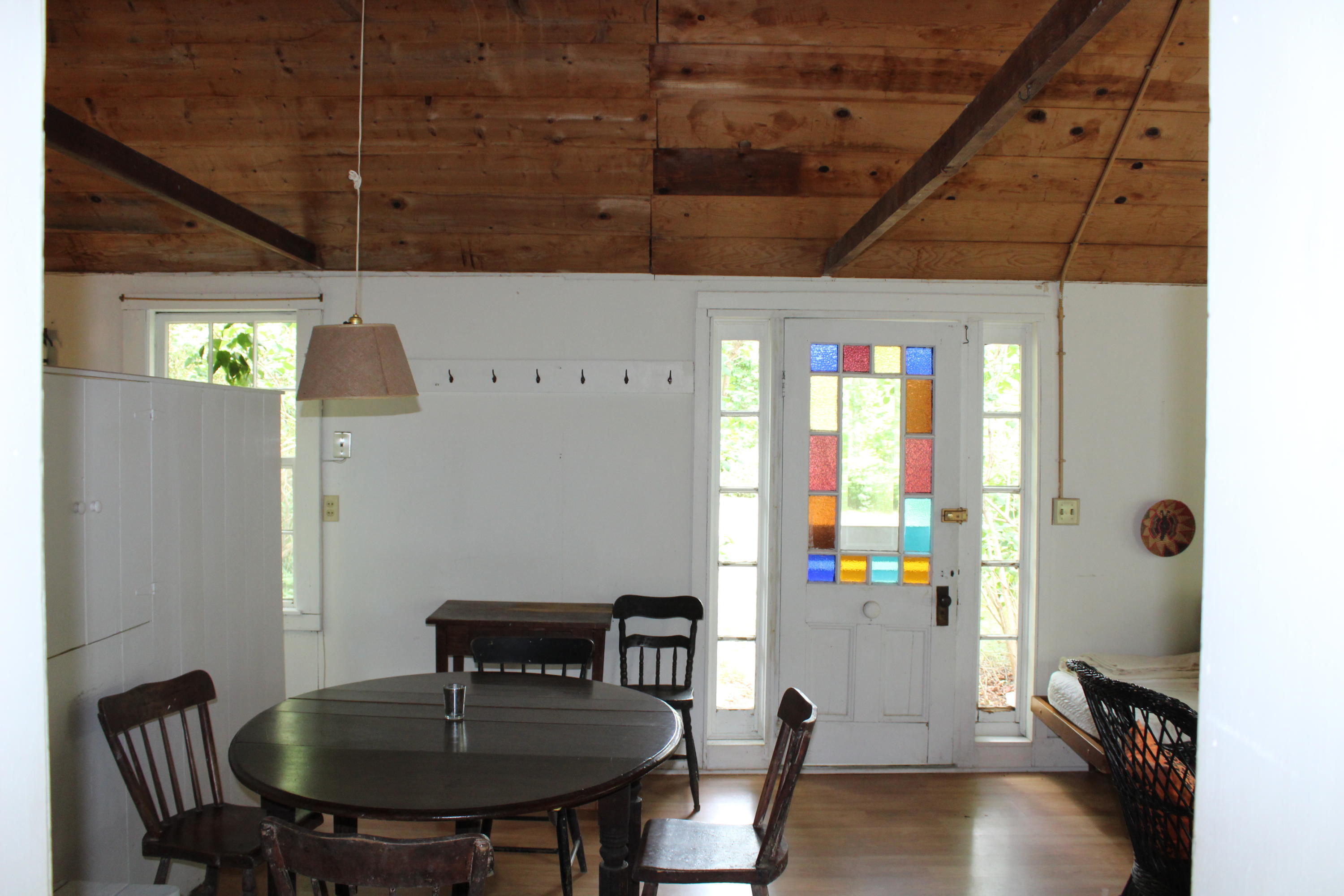 9 Castle Road Truro, MA 02666 - Photo 45 of 65 a view of a dining room with furniture window and wooden floor