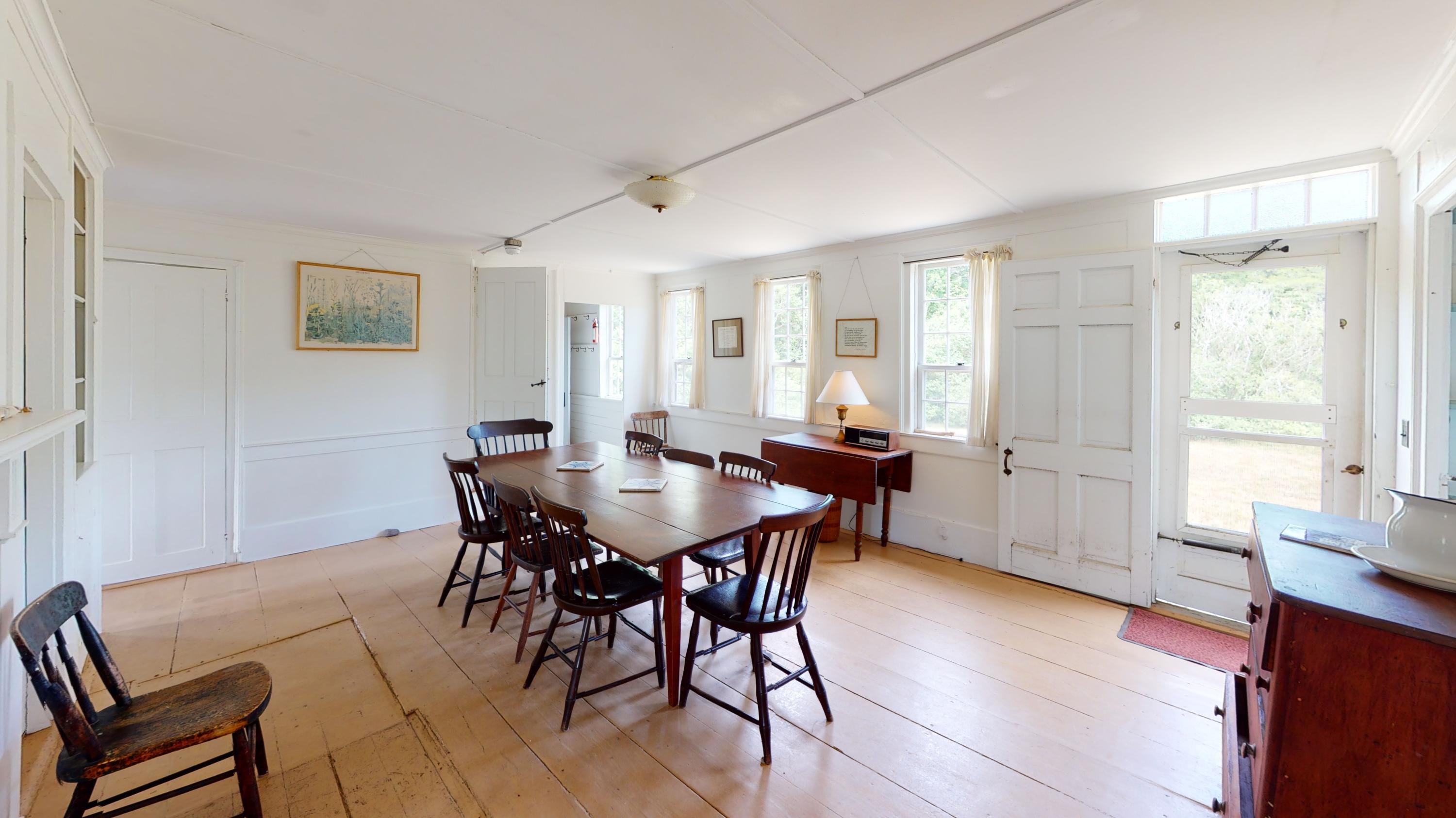 9 Castle Road Truro, MA 02666 - Photo 65 of 65 a view of a dining room with furniture and wooden floor