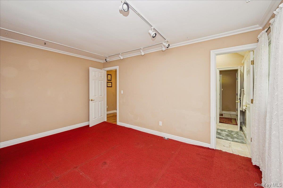 346 Ridgefield Road Hauppauge, NY 11788 - Photo 12 of 45 Carpeted spare room with rail lighting and baseboards