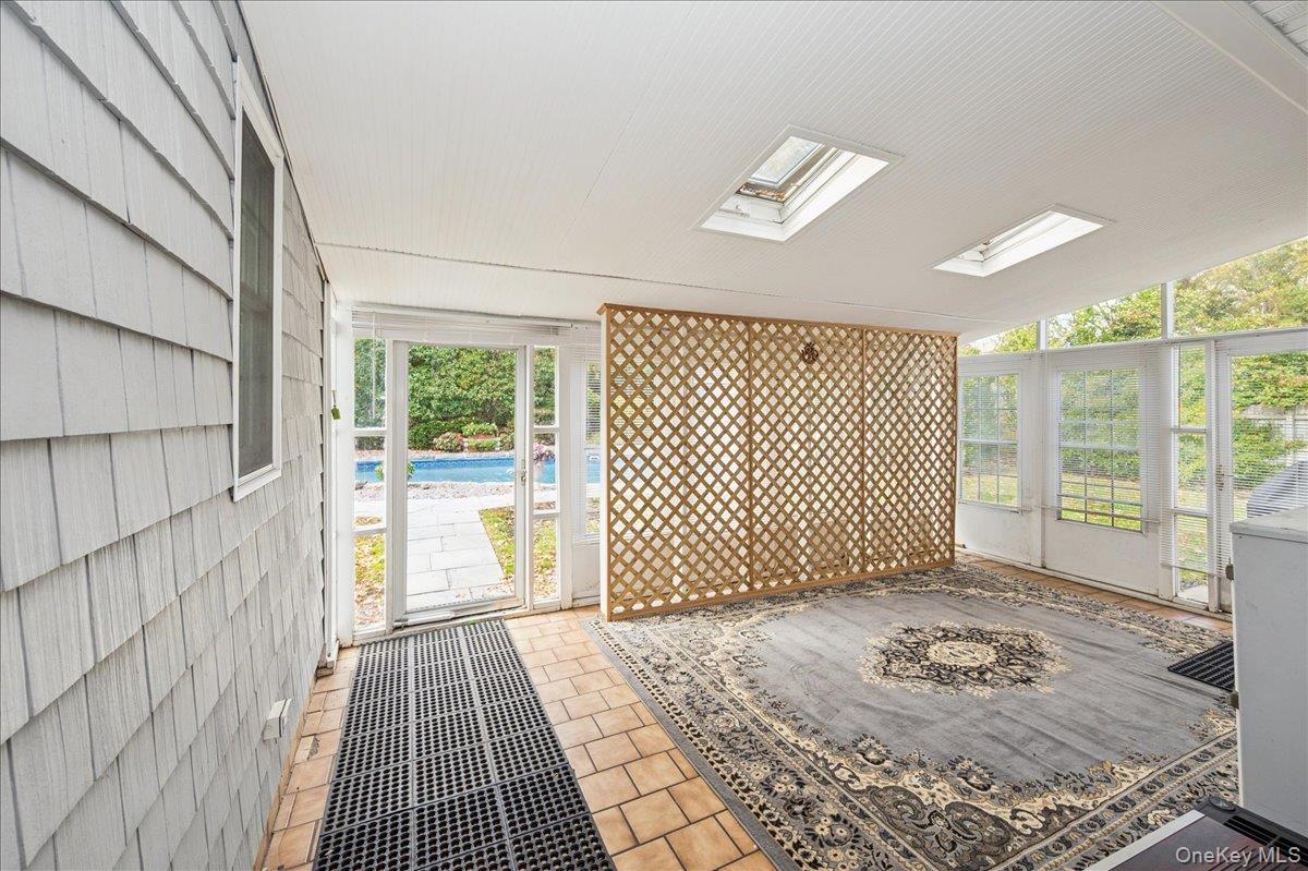 346 Ridgefield Road Hauppauge, NY 11788 - Photo 33 of 45 Unfurnished sunroom featuring a skylight