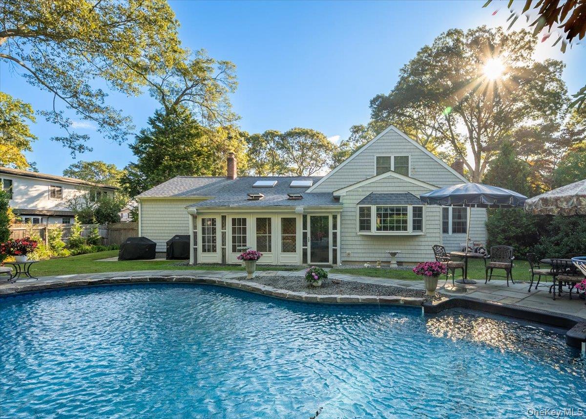 346 Ridgefield Road Hauppauge, NY 11788 - Photo 34 of 45 Rear view of property with a patio, a chimney, and a sunroom