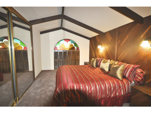 131 Hazel Avenue Millbrae, CA 94030 - Photo 11 of 16 a bedroom with a bed and a mirror