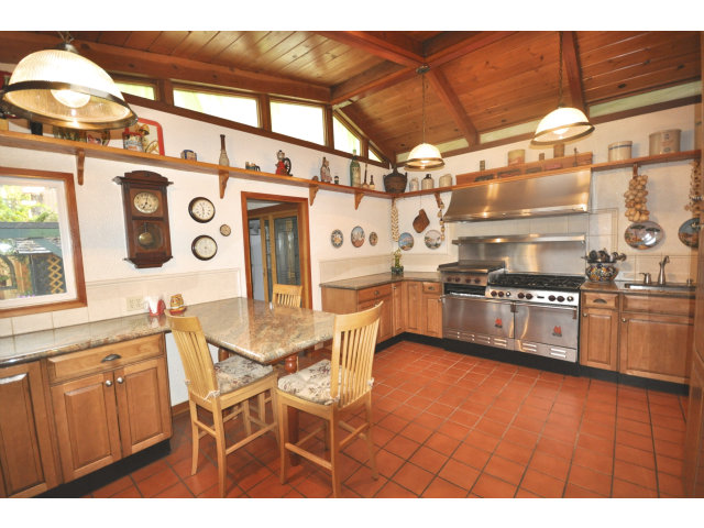 131 Hazel Avenue Millbrae, CA 94030 - Photo 5 of 16 a kitchen with stainless steel appliances granite countertop a sink and cabinets