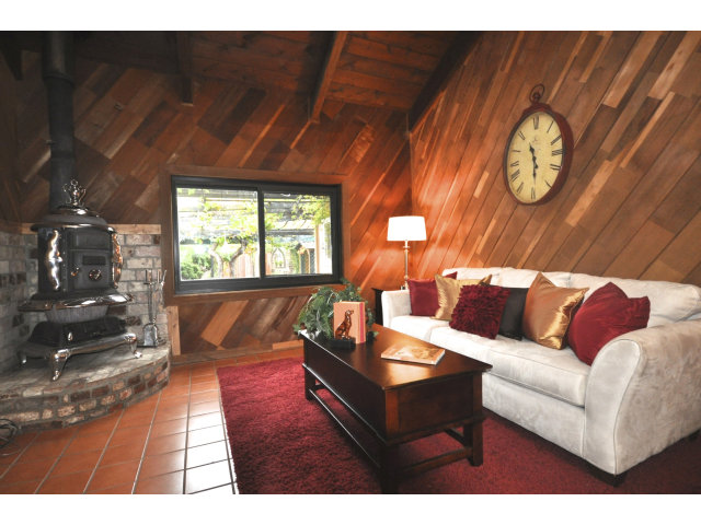 131 Hazel Avenue Millbrae, CA 94030 - Photo 7 of 16 a living room with furniture and a large window