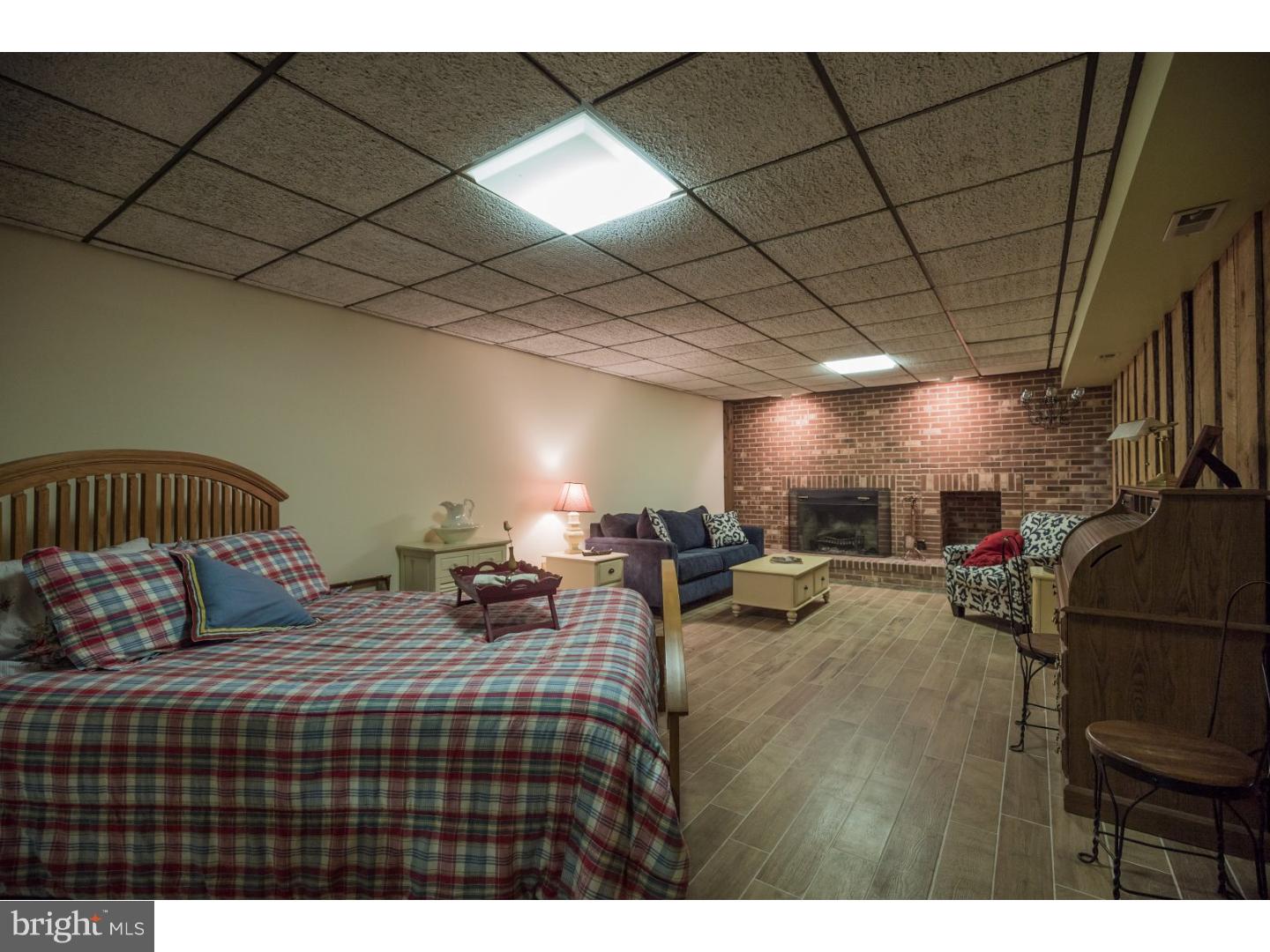 18 Gate Road Tabernacle, NJ 08088 - Photo 16 of 25 a bedroom with furniture and a chandelier