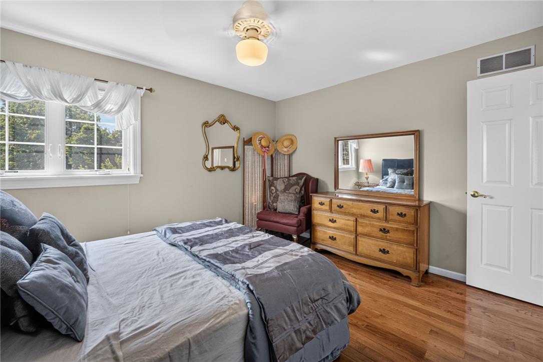 6467 Abbey Road Wind Gap, PA 18091 - Photo 30 of 46 Hardwood floors and a well-lit window define this cozy and comfortable bedroom.