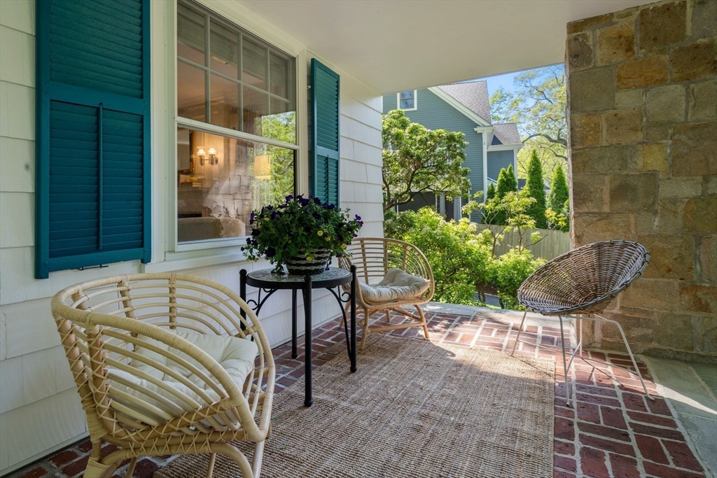 210 Upland Road Newton, MA 02460 - Photo 33 of 41 a house with a outdoor seating space