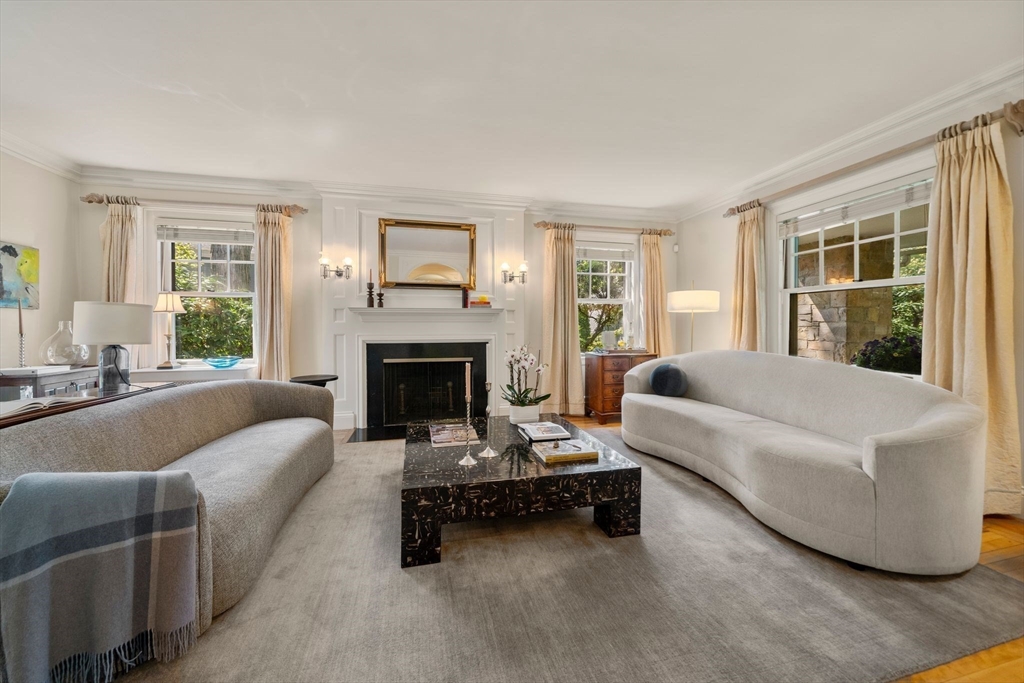 210 Upland Road Newton, MA 02460 - Photo 6 of 41 a living room with furniture and a fireplace