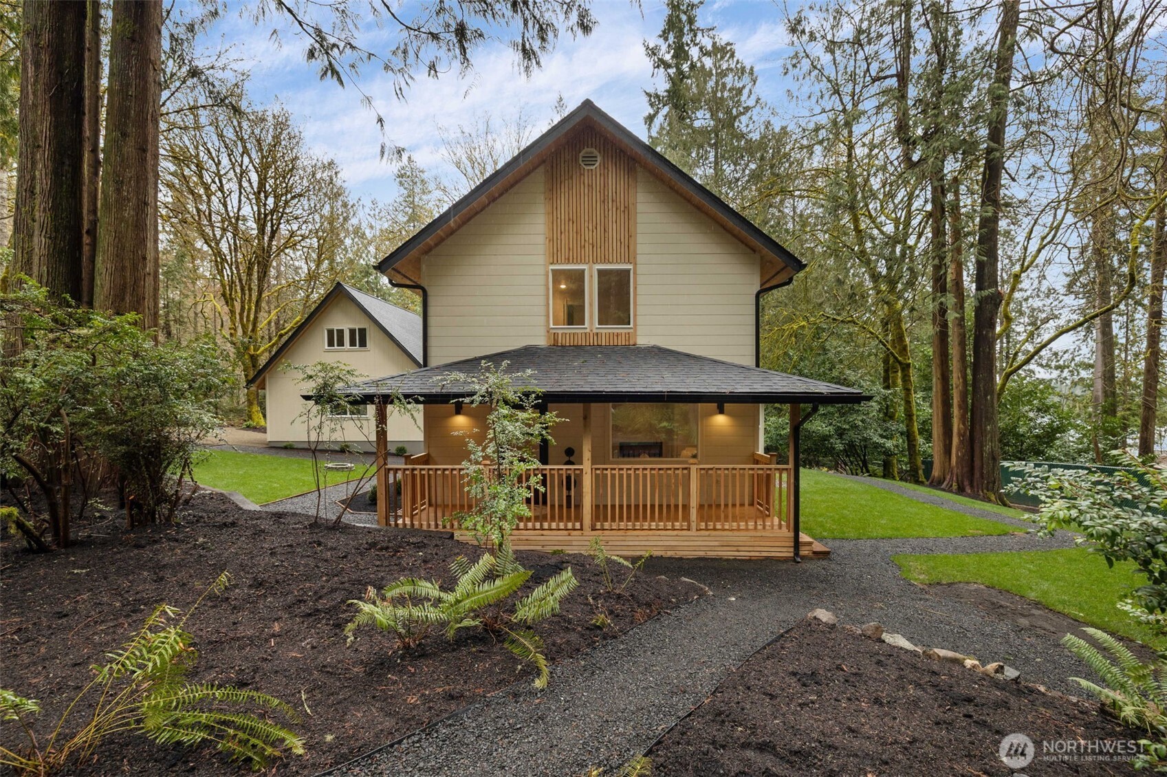 120 East Stadium Lane Grapeview, WA 98546 - Photo 1 of 34 a front view of a house with garden