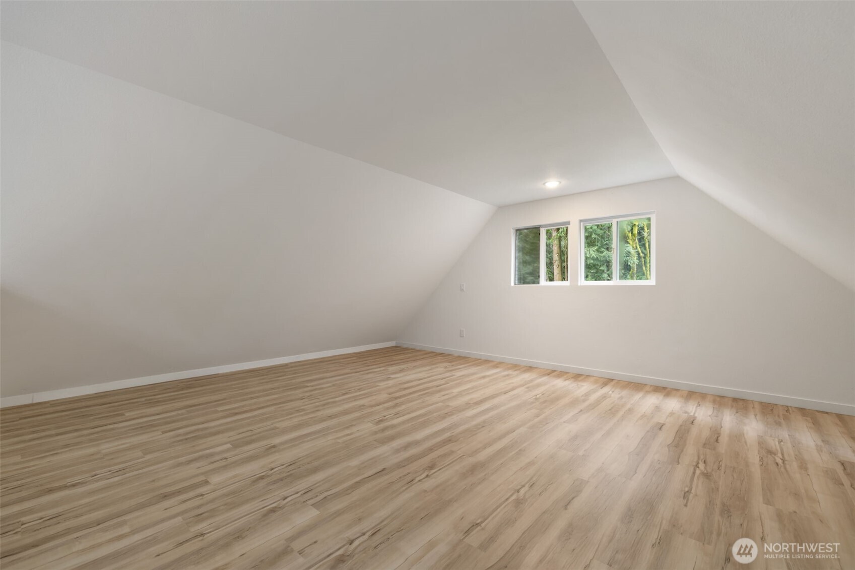 120 East Stadium Lane Grapeview, WA 98546 - Photo 23 of 34 an empty room with wooden floor and windows