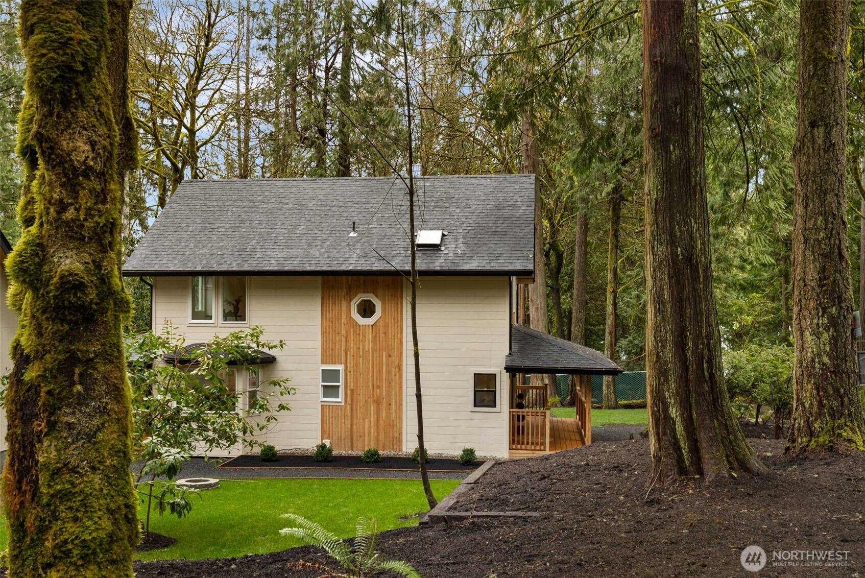 120 East Stadium Lane Grapeview, WA 98546 - Photo 28 of 34 a view of a barn in the middle of a forest