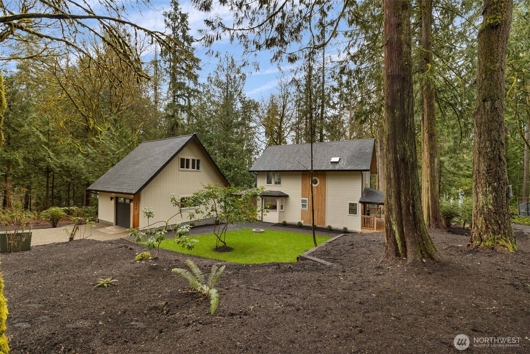 120 East Stadium Lane Grapeview, WA 98546 - Photo 30 of 34 a house that has a tree in front of it