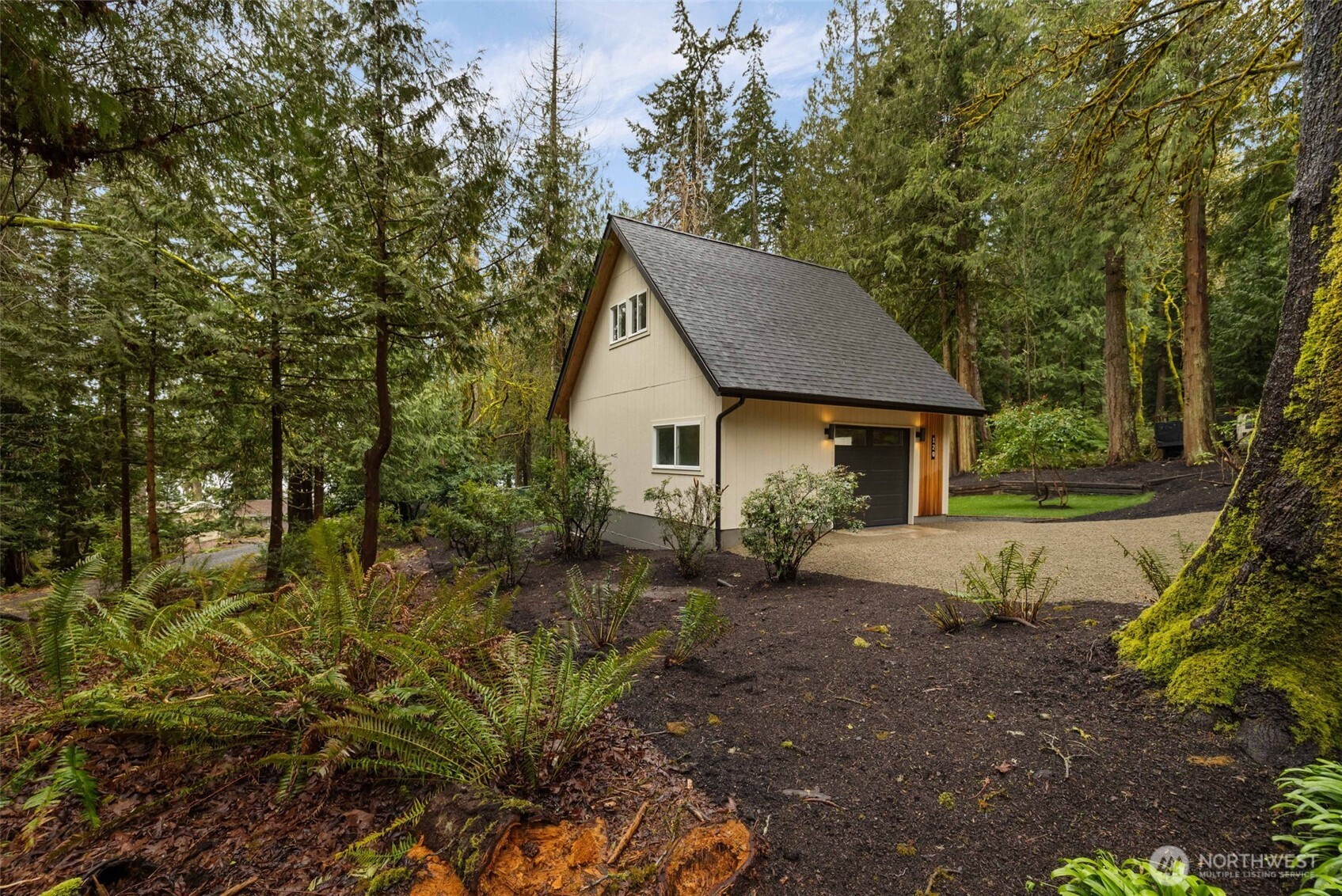 120 East Stadium Lane Grapeview, WA 98546 - Photo 31 of 34 a view of a house with a yard and large tree