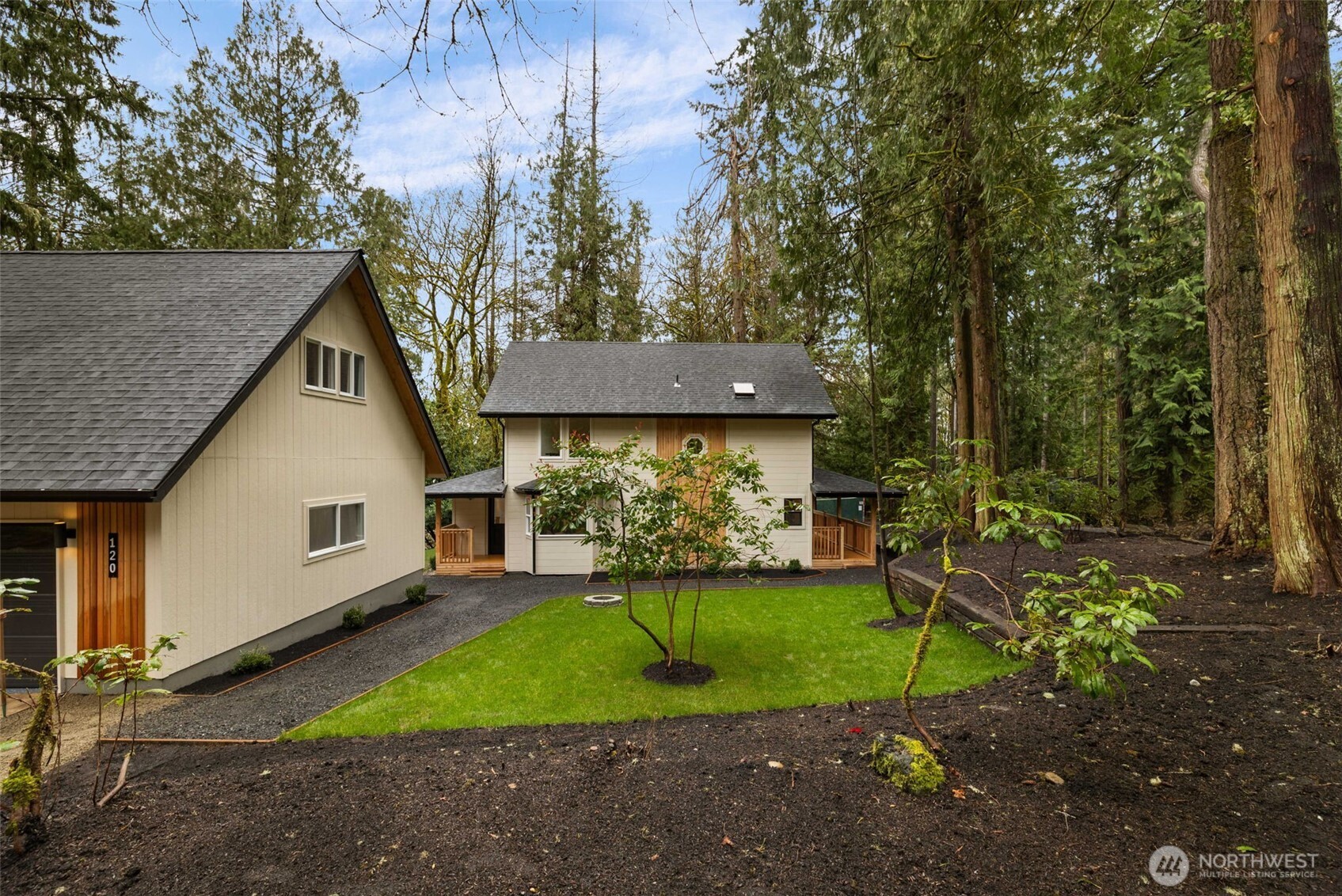 120 East Stadium Lane Grapeview, WA 98546 - Photo 4 of 34 a view of a house with backyard and a garden