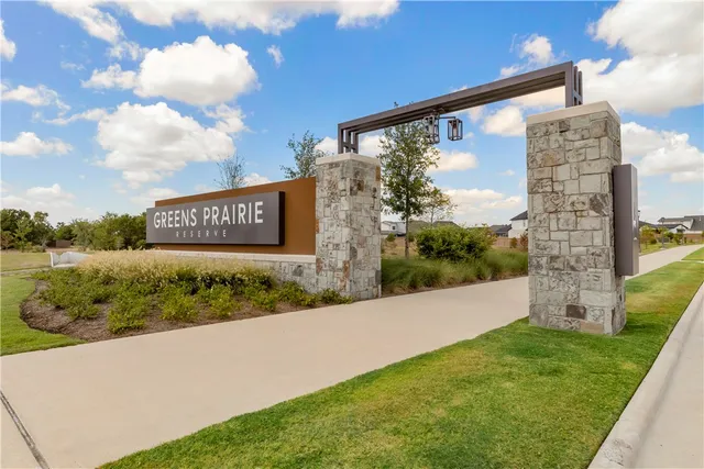 a view of a street with a building in the background